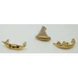 Three 9ct gold charms depicting boats, 7g