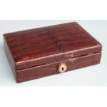 Asprey crocodile skin jewellery box with fitted interior, width 15cm