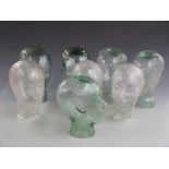 Eight shop display or similar glass heads