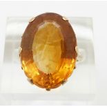 A 9ct gold ring set with a mixed cut citrine, 6g, size L