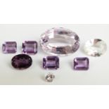 Four emerald cut amethysts, oval cut amethyst, a round cut white sapphire, oval cut quartz and a