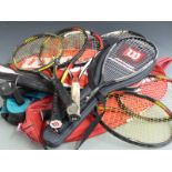 Collection of Wilson tennis racquets, most modern carbon/graphite