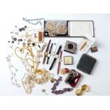 A large collection of costume jewellery including lorgnette, watches, necklaces, amber necklace,