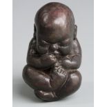 Possibly Eastern Bronze model of a baby, length 7.5cm