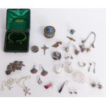 A collection of silver jewellery including earrings, Art Deco silver ring, brooches, charm bracelet,