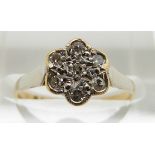 An 18ct gold ring set with diamonds in a flower cluster, 2g, size K