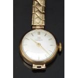 Tissot 9ct gold ladies wristwatch with gold hands and baton markers, silver dial and signed 15 jewel