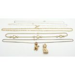 A 9ct gold necklace, two 9ct gold cat pendants, 9ct gold necklaces and a 9ct gold star necklace,
