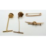 Two 9ct gold brooches, one in the form of a horseshoe and boomerang, 2.6g, 9ct gold pin set with