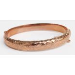 A 9ct rose gold bangle, 10.5g (5.8 x 5.2cm)