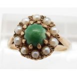 A 9ct gold ring set with turquoise cabochon surrounded by pearls, 3.4g, size Q
