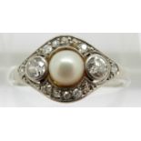 Art Deco platinum ring set with a pearl, two diamonds each approximately 0.1ct and further diamonds,