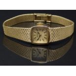 Roamer 18ct gold ladies wristwatch with black hands, gold baton markers, gold dial and signed 19