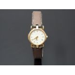 Gucci gold plated ladies wristwatch ref. 3400 with gold dauphine hands, black Roman numerals,