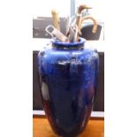 Large floor vase with powder blue glaze containing carved sticks and a shooting seat, H70cm