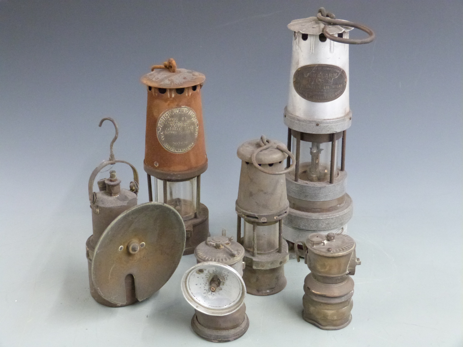 Six various miner's lamps including Spiralarm type S, Protector Lamp & Lighting Co Ltd, Baby Wolf