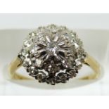 An 18ct gold ring set with diamonds in a platinum cluster, 3.8g, size M