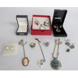 A collection of silver jewellery including a suite of abalone jewellery, mother of pearl suite of