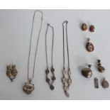 Silver necklaces and pendants including novelty cat examples