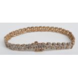 A 9ct gold bracelet set with diamonds, 9.8g