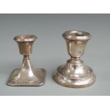 Two hallmarked silver squat candlesticks, one Birmingham 1925, the other 1931, height of taller 8.