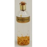 A bottle of 24ct gold leaf.