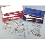 Quantity of silver plated ware including carving set with mounts marked sterling, cased fish servers