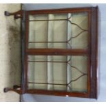 Glazed mahogany display cabinet raised on cabriole legs terminating in ball and claw feet, W108 x