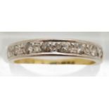 An 18ct gold half eternity ring set with diamonds in a white gold setting, 2.8g, size M