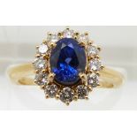 An 18ct gold bespoke ring set with a 1.7ct natural untreated royal blue sapphire surrounded by