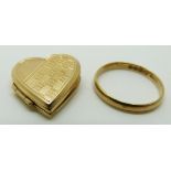 A 9ct gold heart locket 4g and an 18ct gold wedding ring / band 2.3g