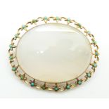 Victorian brooch set with chalcedony within by a gold border set with turquoise, 20.6g, 5.2 x 4.2cm