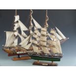 Two model sailing ships on stands, height of taller 60cm