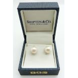 A pair of 9ct gold pearl set earrings