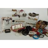 A collection of costume jewellery including agate beads, beaded necklaces, Victorian dress watch