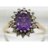 A 9ct gold ring set with an amethyst and diamonds, 2.5g, size N