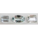 A rectangular cut aquamarine measuring approximately 7.4ct, an oval cut aquamarine measuring