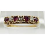 An 18ct gold ring set with alternating rubies and diamonds, 2.9g, size L