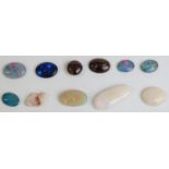 Eleven various opals comprising five triplets, two boulder cabochons and three white examples.