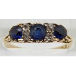 An 18ct gold ring set with sapphires and diamonds, 2.7g, size P