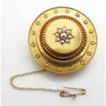 Victorian Etruscan Revival gold brooch set with seed pearls to the centre, verso a glass