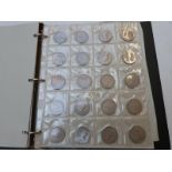 An amateur UK coin collection including coins with silver content, modern crowns etc, in an album