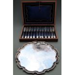 Silver plated salver, diameter 35cm, and a boxed set of 12 fish knives and forks
