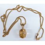A 9ct gold necklace with pendant set with an oval cut citrine and diamond, 24cm drop, 5.8g