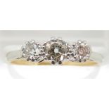 An 18ct gold ring set with three diamonds of approximately 0.25, 0.15 & 0.15ct in a platinum