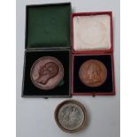 Two large bronze 19thC medal coins one for Queen Victoria, the other for Albert Prince Consort;