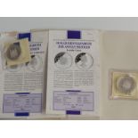 A Five dollar and One dollar silver proof coins,  in MDM packs, with certificates