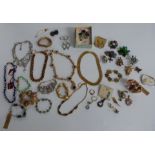 A collection of costume jewellery including Monet, Butler & Wilson, Trifari, 9ct gold ring (2.4g)