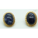 A pair of 18k gold earrings set with sodalite