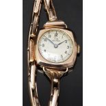 Record 9ct gold ladies wristwatch with blued hands, black Arabic numerals, silver dial, cushion